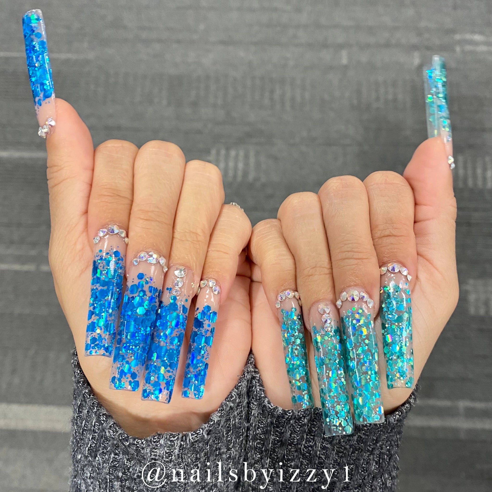 Blue Holographic Glitter Nails On The Left. Turquoise Holographic Glitter Nails On The Right.  A Photo From Our Customer, Ashley.